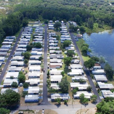 aerial view of homes and lake