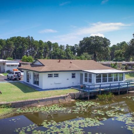 aerial view of building and lake/homes